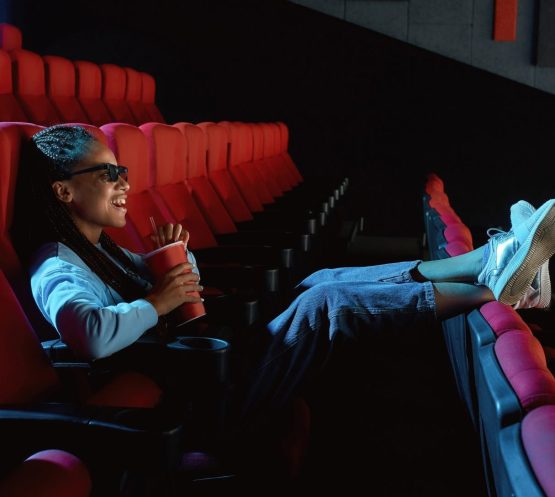 Cheerful,Young,Woman,In,3d,Glasses,Laughing,,Putting,Her,Feet