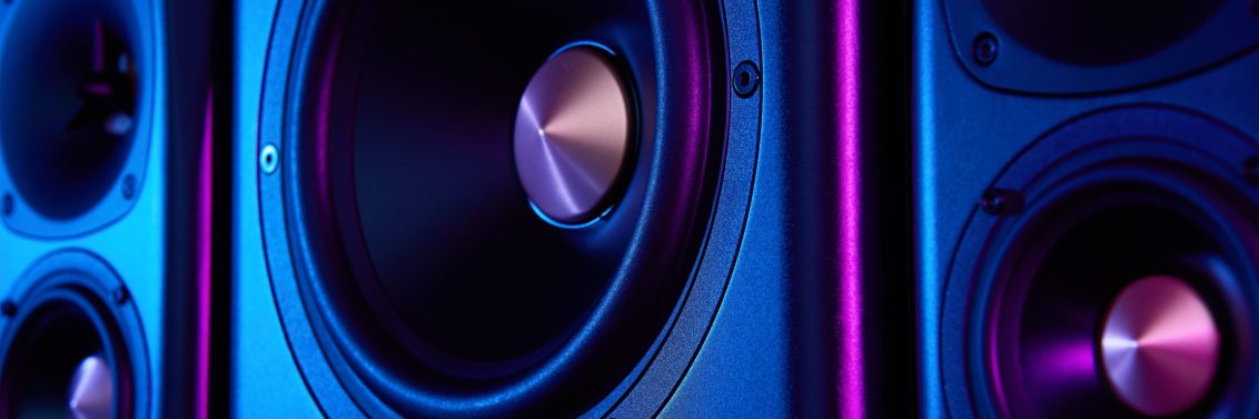 Two,Sound,Speakers,And,Subwoofer,On,Dark,Background,With,Neon